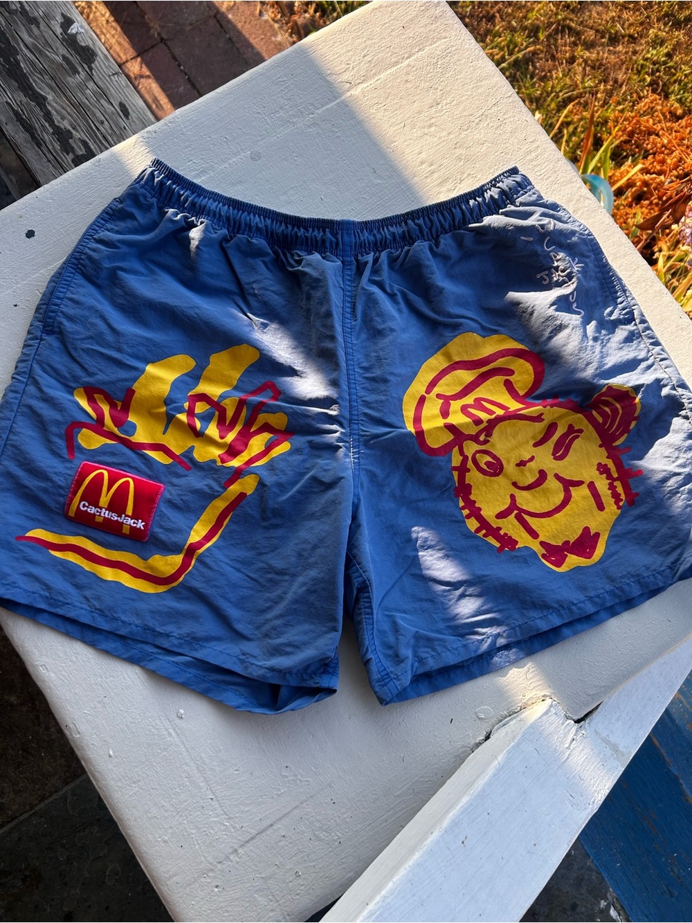 Cactus Jack x Travis Scott Blue Swim Trunks with Yellow and Red Graphics